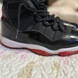 Jordan 11 Black and Red Sneakers with Patent Leather